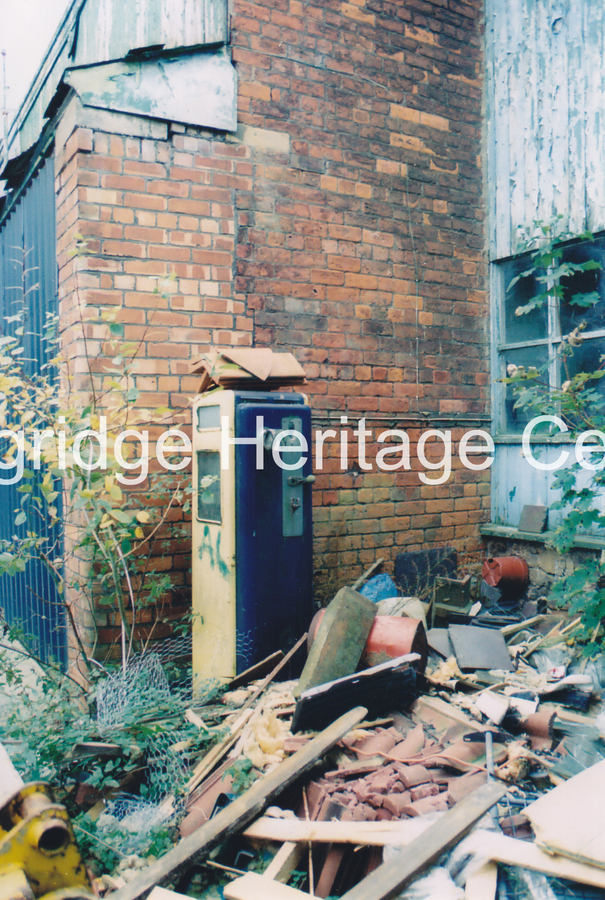 837A - Co-op building - Buildings at the rear off Barclay Roa showing petrol pump. - 2002-2005